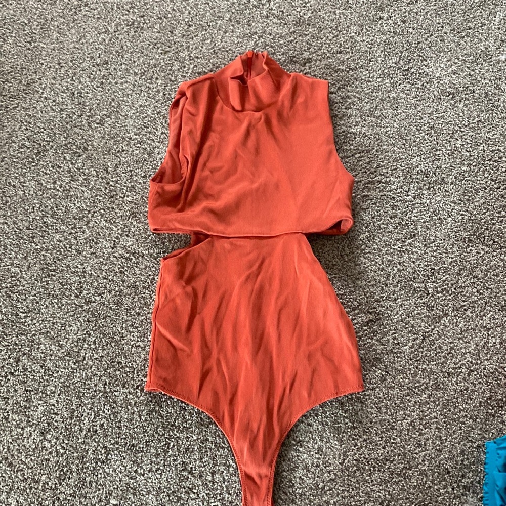 Body suit with slits on the side